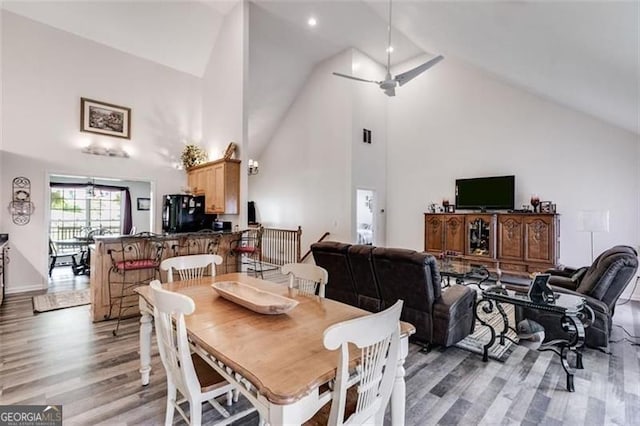 144 Bobs Dr, Mableton, GA 30126 - dining area with light wood finished floors, high vaulted ceiling, and ceiling fan