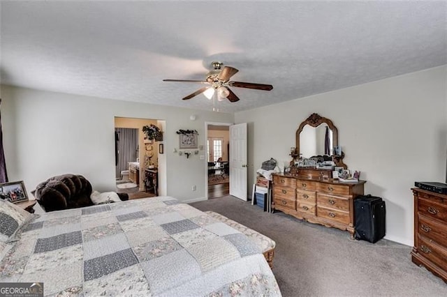 144 Bobs Dr, Mableton, GA 30126 - carpeted bedroom with a ceiling fan and a textured ceiling
