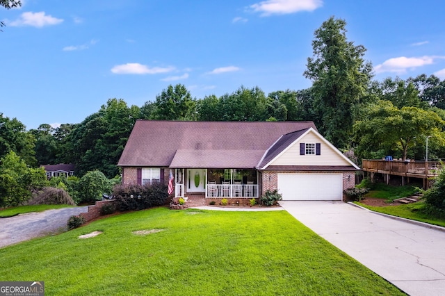144 Bobs Dr, Mableton, GA 30126 - view of front of property with brick siding, a front lawn, concrete driveway, covered porch, and a garage