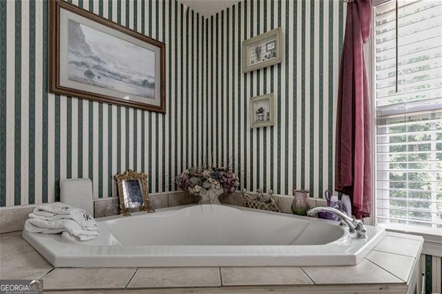 144 Bobs Dr, Mableton, GA 30126 - bathroom featuring wallpapered walls and a bath