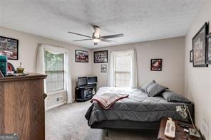144 Bobs Dr, Mableton, GA 30126 - bedroom with ceiling fan and carpet floors