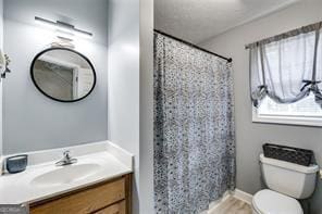 144 Bobs Dr, Mableton, GA 30126 - bathroom with curtained shower, toilet, vanity, and wood finished floors