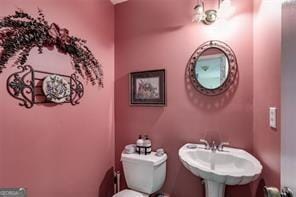 144 Bobs Dr, Mableton, GA 30126 - bathroom featuring toilet and a sink