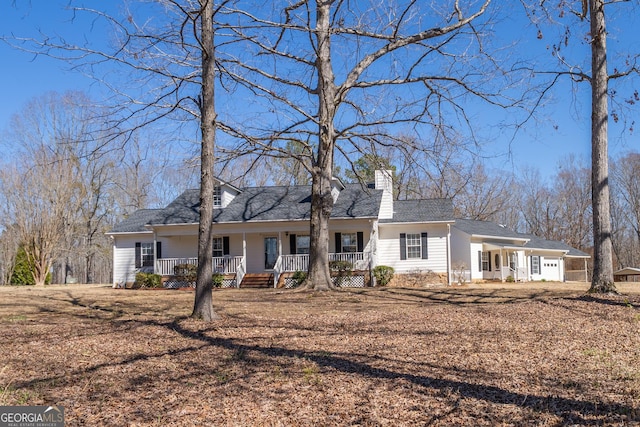 1650 Pierce Dairy Rd, Madison, GA 30650 - ranch-style home featuring a chimney and covered porch