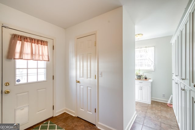 1650 Pierce Dairy Rd, Madison, GA 30650 - entryway with baseboards and light tile patterned flooring