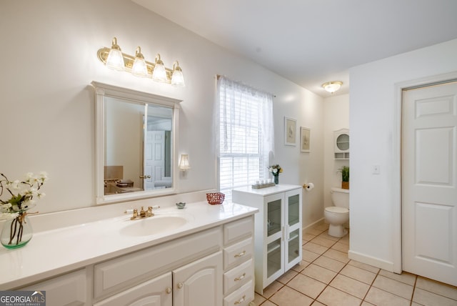 1650 Pierce Dairy Rd, Madison, GA 30650 - bathroom featuring toilet, tile patterned floors, and vanity