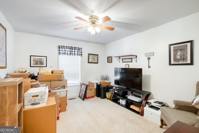 1650 Pierce Dairy Rd, Madison, GA 30650 - carpeted living area with baseboards and a ceiling fan
