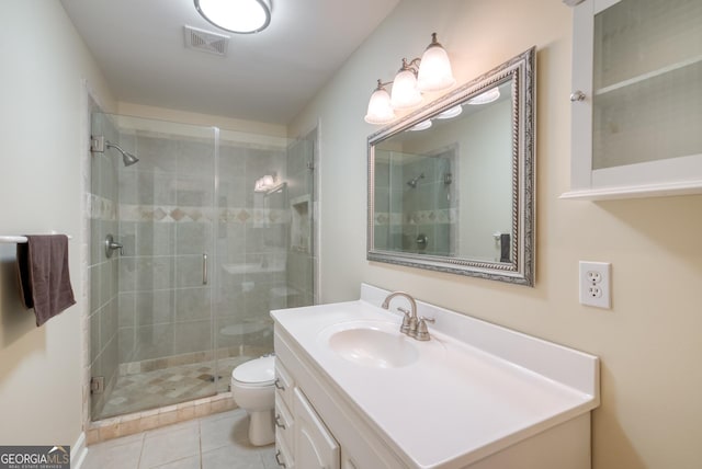 1650 Pierce Dairy Rd, Madison, GA 30650 - bathroom featuring visible vents, toilet, vanity, tile patterned floors, and a stall shower