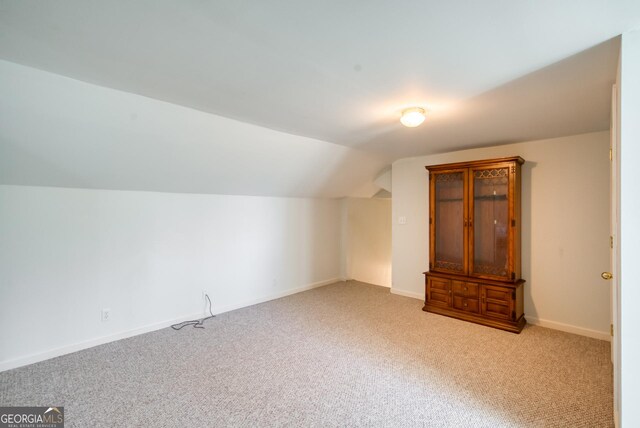1650 Pierce Dairy Rd, Madison, GA 30650 - bonus room featuring carpet floors, baseboards, and vaulted ceiling