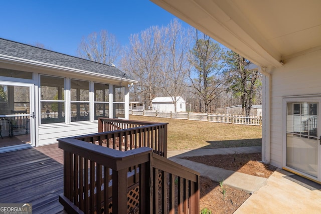 1650 Pierce Dairy Rd, Madison, GA 30650 - wooden deck with a fenced backyard, a sunroom, and a lawn