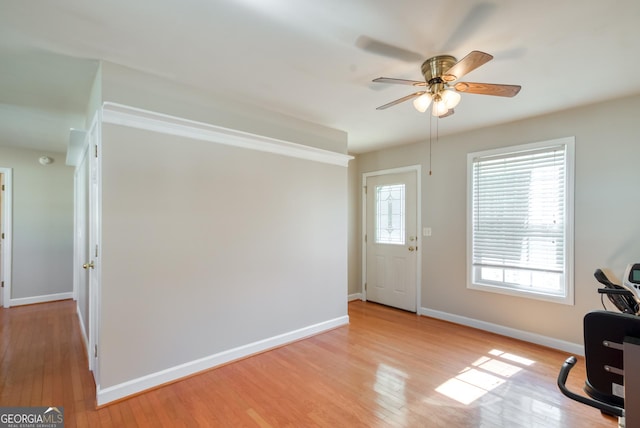 1650 Pierce Dairy Rd, Madison, GA 30650 - entrance foyer with light wood-type flooring, baseboards, and a ceiling fan