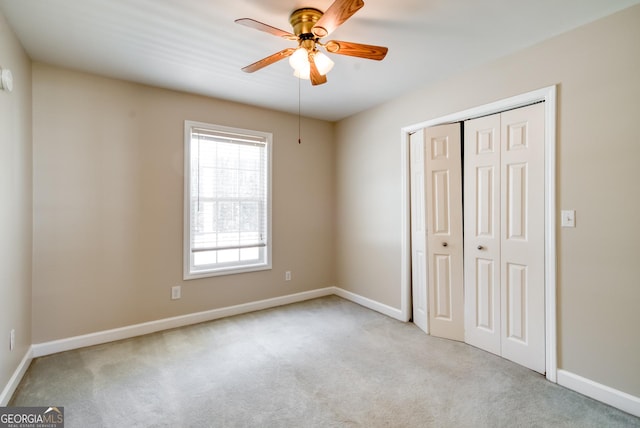 1650 Pierce Dairy Rd, Madison, GA 30650 - unfurnished bedroom with carpet floors, baseboards, a ceiling fan, and a closet