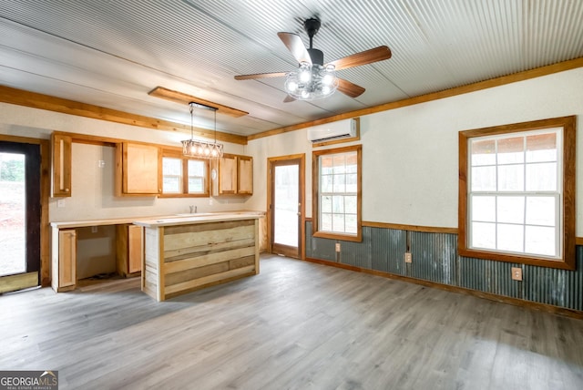 1650 Pierce Dairy Rd, Madison, GA 30650 - kitchen with light wood-style flooring, ceiling fan, a wainscoted wall, and a wall unit AC