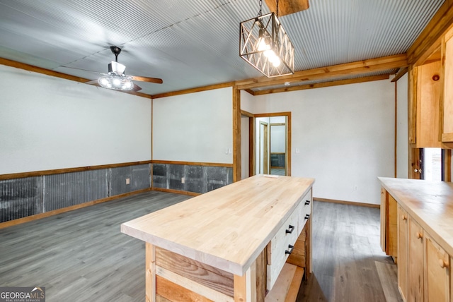 1650 Pierce Dairy Rd, Madison, GA 30650 - kitchen with hanging light fixtures, a ceiling fan, wood counters, and wood finished floors