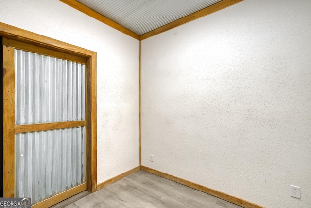 1650 Pierce Dairy Rd, Madison, GA 30650 - empty room with light wood-style floors and baseboards