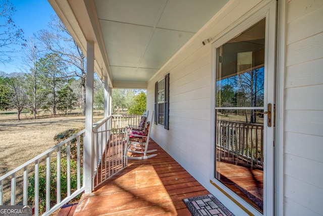 1650 Pierce Dairy Rd, Madison, GA 30650 - wooden deck featuring a porch