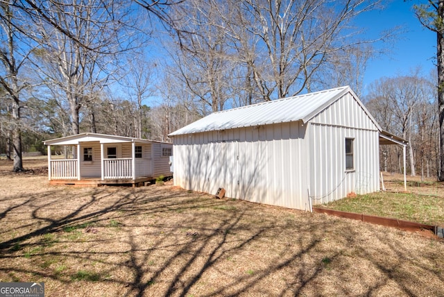 1650 Pierce Dairy Rd, Madison, GA 30650 - view of outdoor structure with covered porch and an outdoor structure