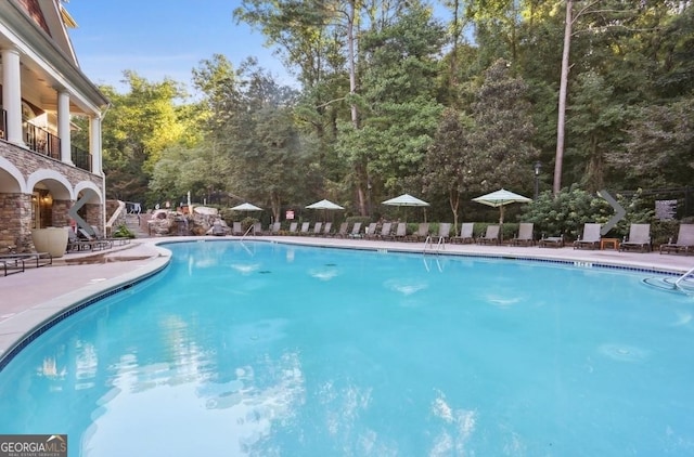 pool with a patio area