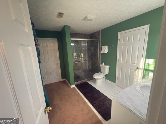 bathroom with baseboards, visible vents, a stall shower, a textured ceiling, and toilet