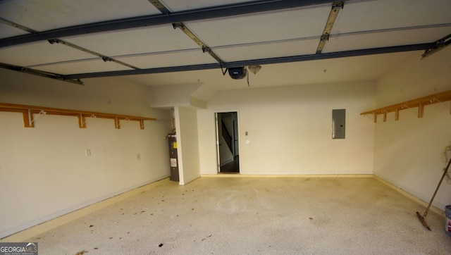 garage featuring electric panel, a garage door opener, and electric water heater