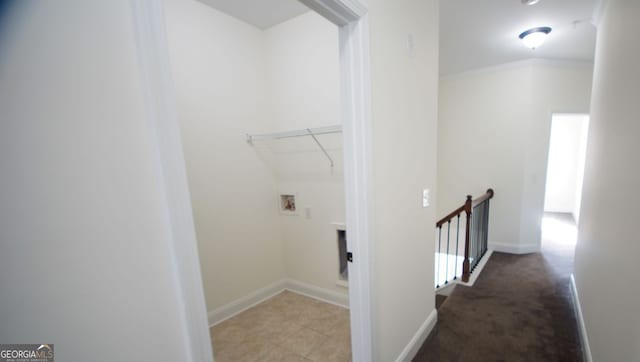 washroom featuring baseboards, carpet floors, hookup for a washing machine, and laundry area