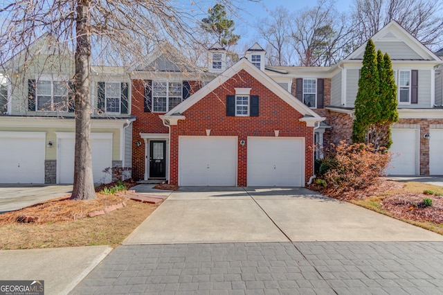 view of front of property with stone siding and driveway