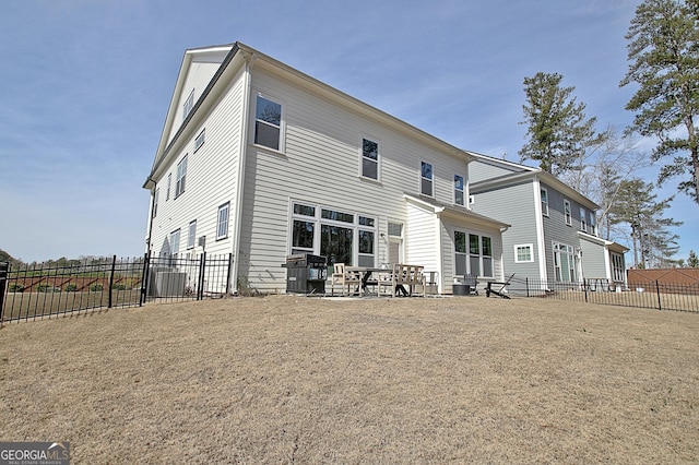 back of property featuring a patio and fence