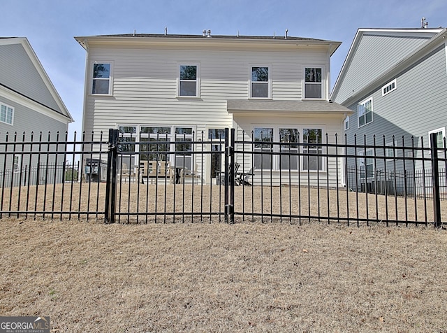 back of property featuring fence