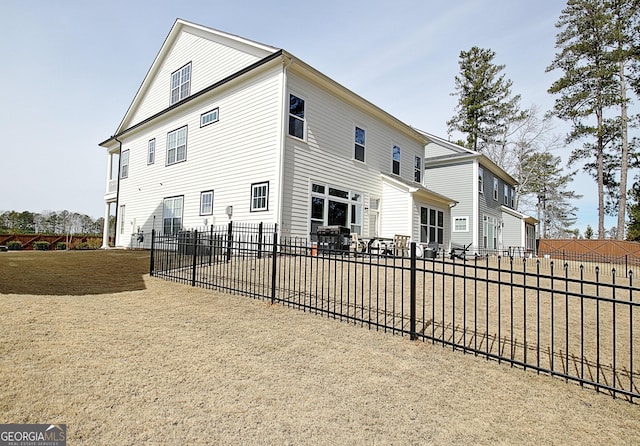 view of property exterior with fence and a patio area