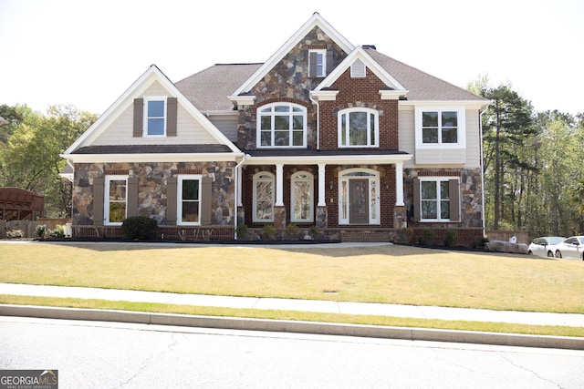 838 Natchez Valley Trce NE, Grayson, GA 30017 - craftsman-style house featuring stone siding, a front yard, and a porch