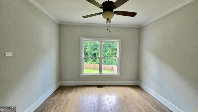 838 Natchez Valley Trce NE, Grayson, GA 30017 - unfurnished room with wood finished floors, crown molding, and a ceiling fan
