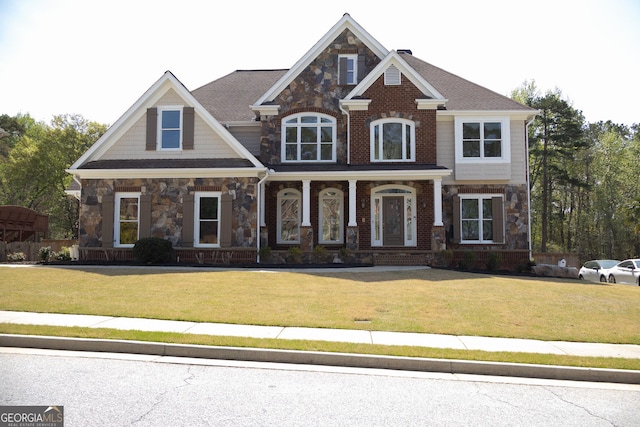838 Natchez Valley Trce NE, Grayson, GA 30017 - craftsman-style home with stone siding, a front yard, and a porch