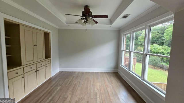 838 Natchez Valley Trce NE, Grayson, GA 30017 - spare room featuring a tray ceiling, wood finished floors, crown molding, and ceiling fan
