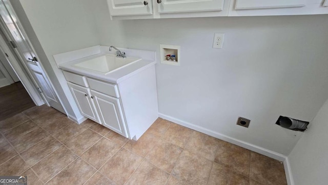 838 Natchez Valley Trce NE, Grayson, GA 30017 - laundry area featuring electric dryer hookup, hookup for a washing machine, cabinet space, and tile patterned floors