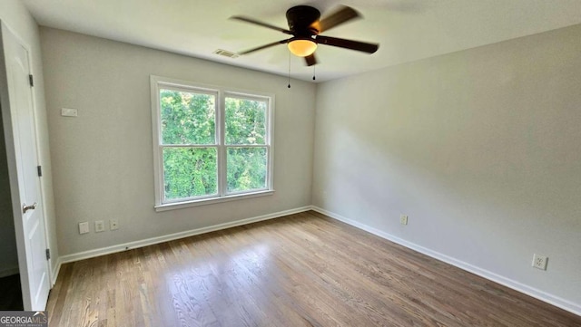 838 Natchez Valley Trce NE, Grayson, GA 30017 - spare room featuring a ceiling fan and wood finished floors