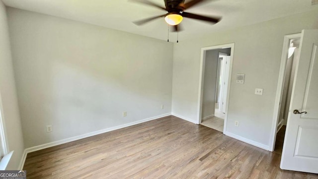 838 Natchez Valley Trce NE, Grayson, GA 30017 - unfurnished bedroom with wood finished floors and a ceiling fan