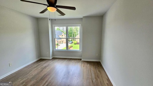 838 Natchez Valley Trce NE, Grayson, GA 30017 - empty room with dark wood-style flooring and a ceiling fan