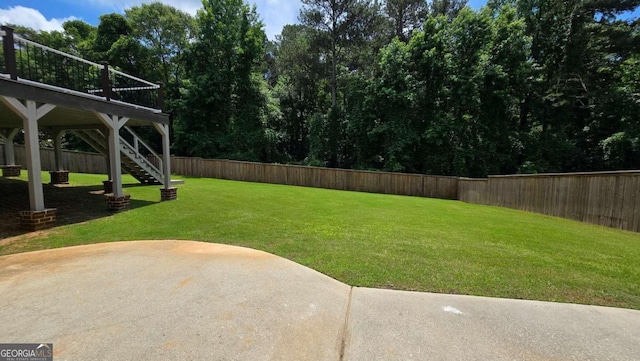 838 Natchez Valley Trce NE, Grayson, GA 30017 - fenced backyard featuring a patio and stairway