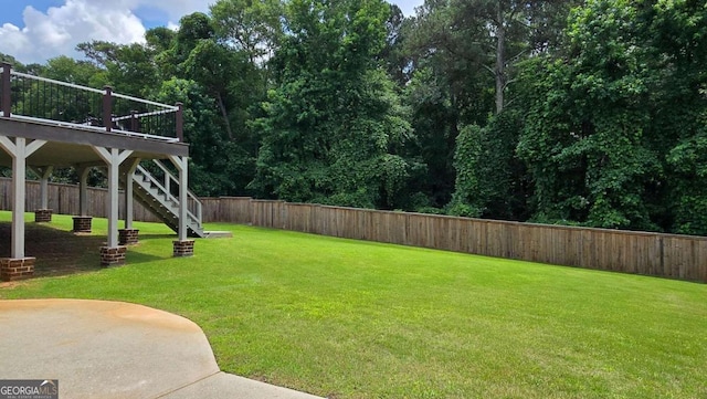 838 Natchez Valley Trce NE, Grayson, GA 30017 - fenced backyard with stairs and a wooden deck