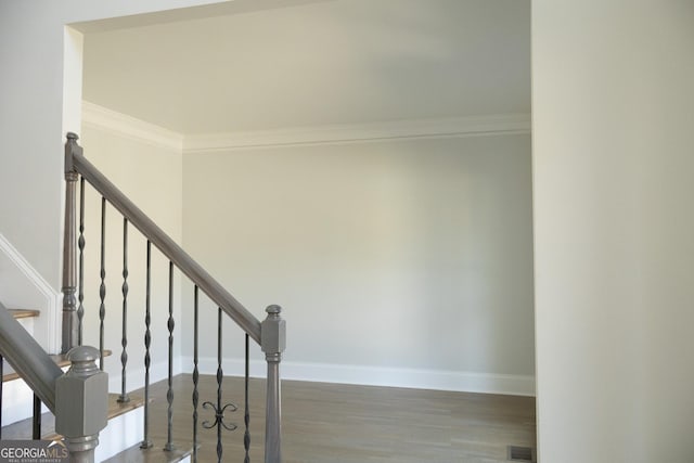 838 Natchez Valley Trce NE, Grayson, GA 30017 - stairs featuring crown molding and wood finished floors