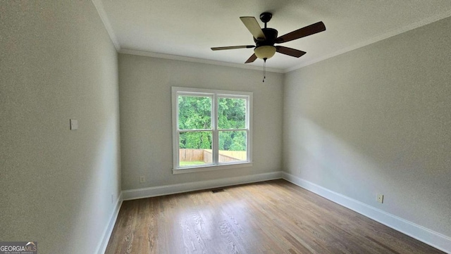 838 Natchez Valley Trce NE, Grayson, GA 30017 - spare room featuring crown molding, wood finished floors, and a ceiling fan