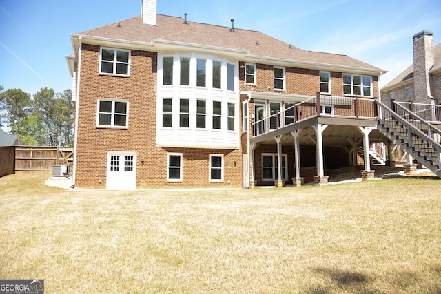 838 Natchez Valley Trce NE, Grayson, GA 30017 - back of house with brick siding, stairs, and a deck