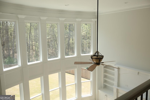 838 Natchez Valley Trce NE, Grayson, GA 30017 - detailed view of ceiling fan, a decorative wall, and crown molding