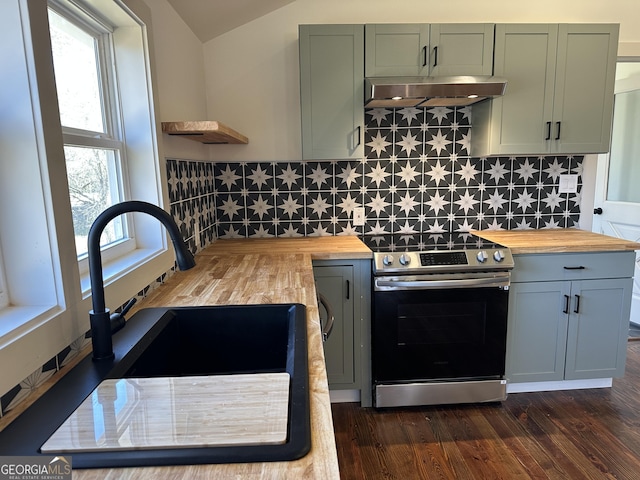 kitchen with range hood, wood counters, electric stove, and vaulted ceiling