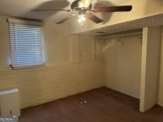 2976 Nelson Dr, Duluth, GA 30096 - unfurnished bedroom featuring carpet floors, a textured ceiling, and a ceiling fan