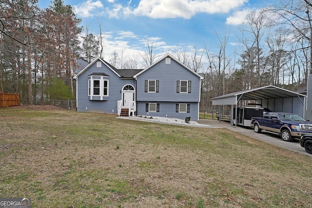 exterior space with entry steps, a carport, fence, and a lawn