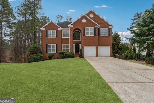 view of front of house with brick siding, a garage, driveway, and a front yard