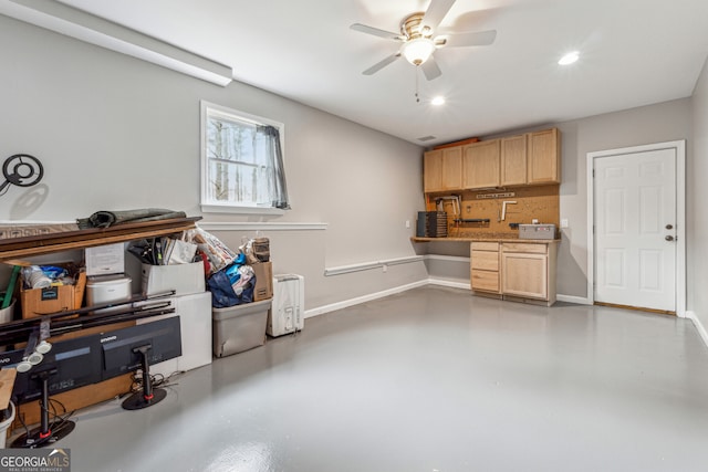 garage featuring recessed lighting, a ceiling fan, and baseboards