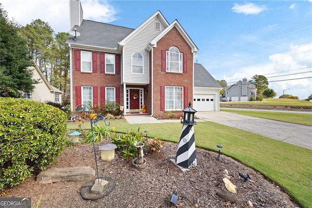 view of front of home with brick siding, a front yard, a chimney, a garage, and driveway