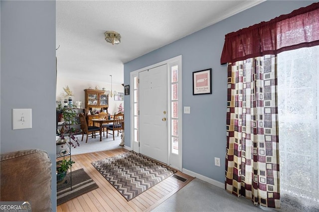 2000 Spicers Ln, Woodstock, GA 30189 - entryway with a textured ceiling, baseboards, and wood-type flooring